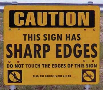 Caution: This sign has sharp edges. Do not Touch the edges of this sign. Also the bridge is out.